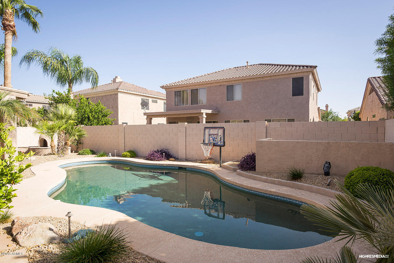 505 East Ranch Road Gilbert, AZ 85296 - Photo 21 of 22 a view of a house with a tub and a fire pit