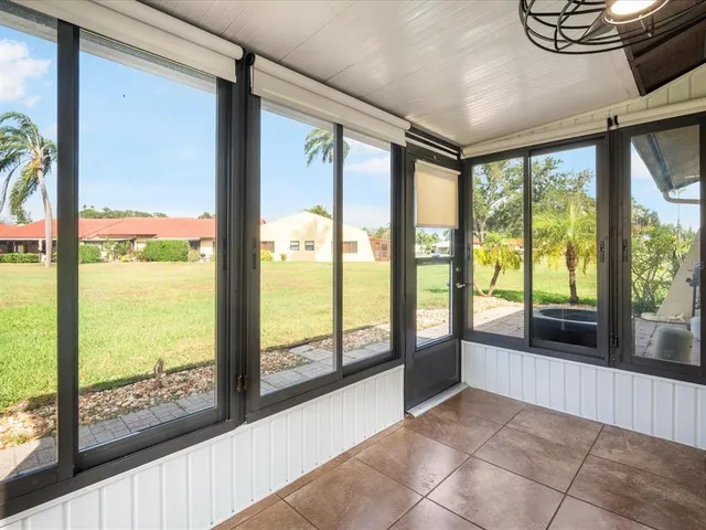 a view of an entryway with a floor to ceiling window
