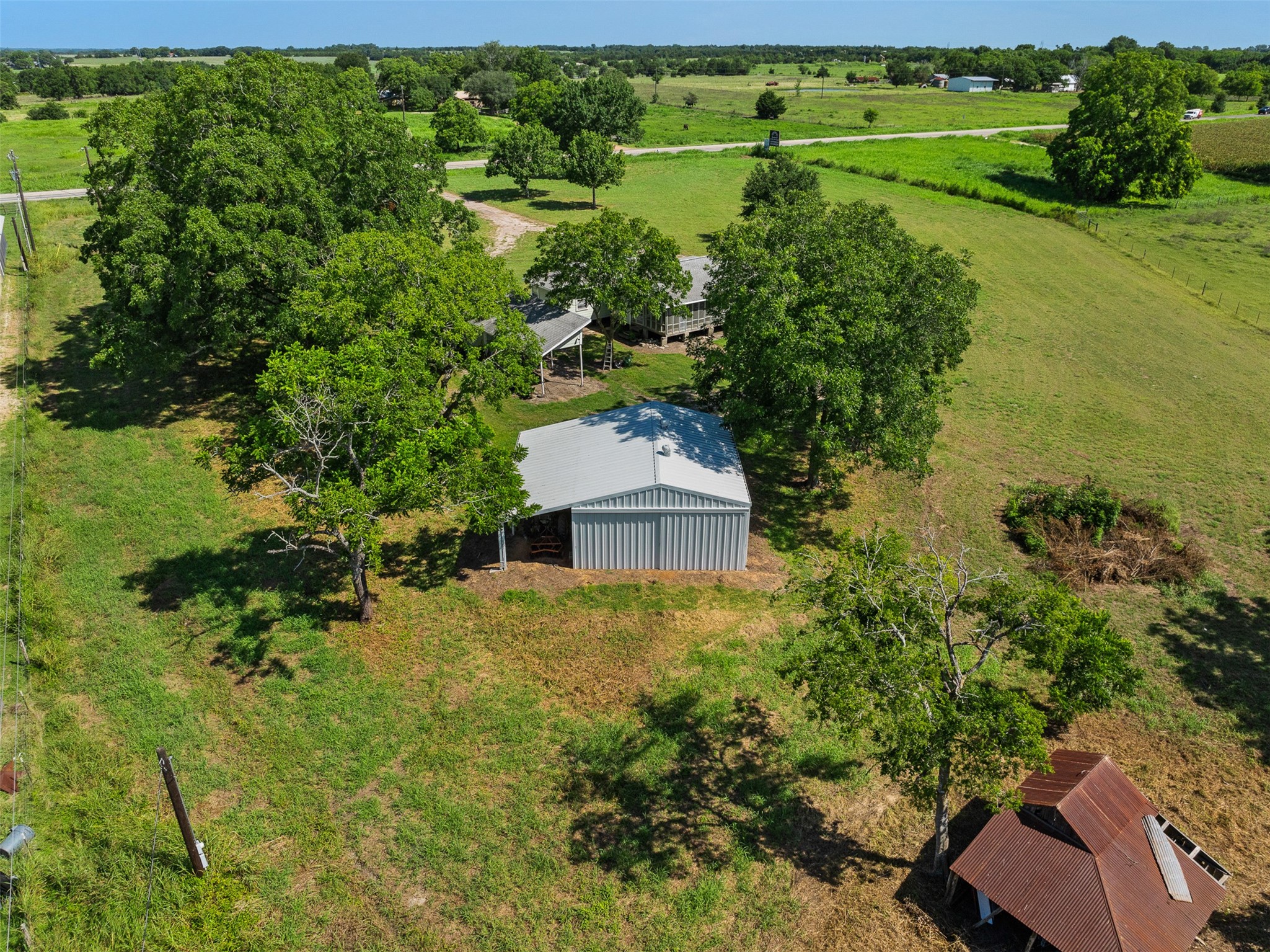 1619 Highway 237 Carmine, TX 78932 - Photo 11 of 26 an aerial view of a house with a yard and lake view