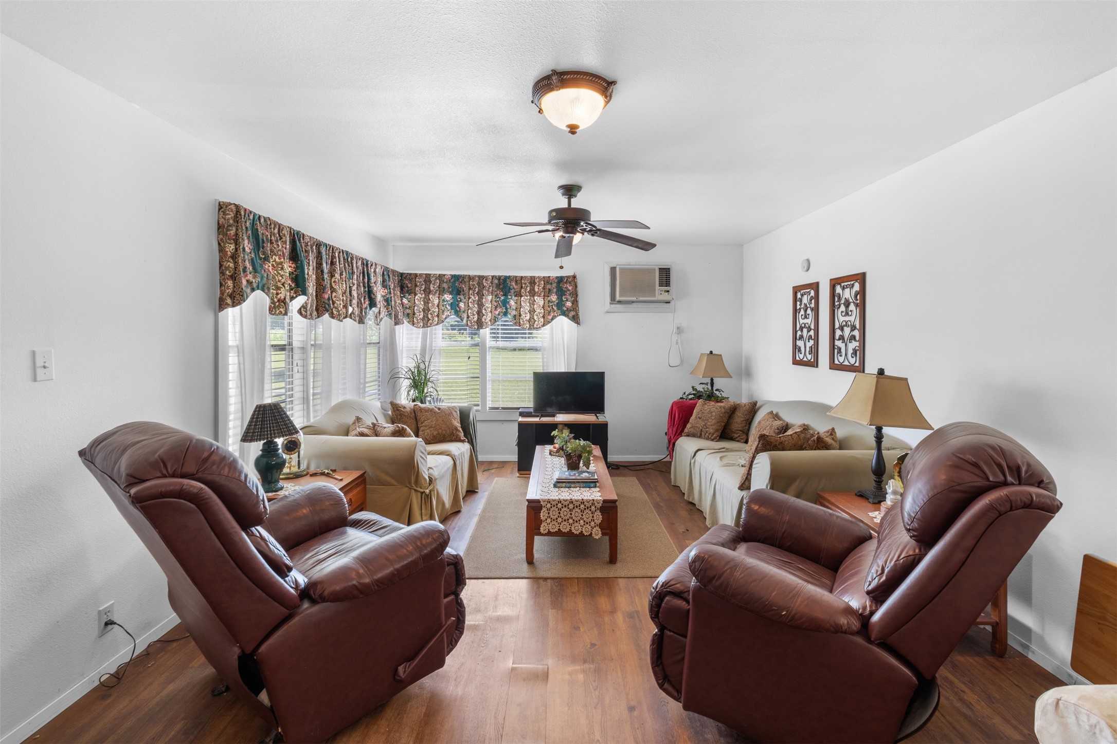 1619 Highway 237 Carmine, TX 78932 - Photo 16 of 26 a living room with furniture a fireplace and a chandelier