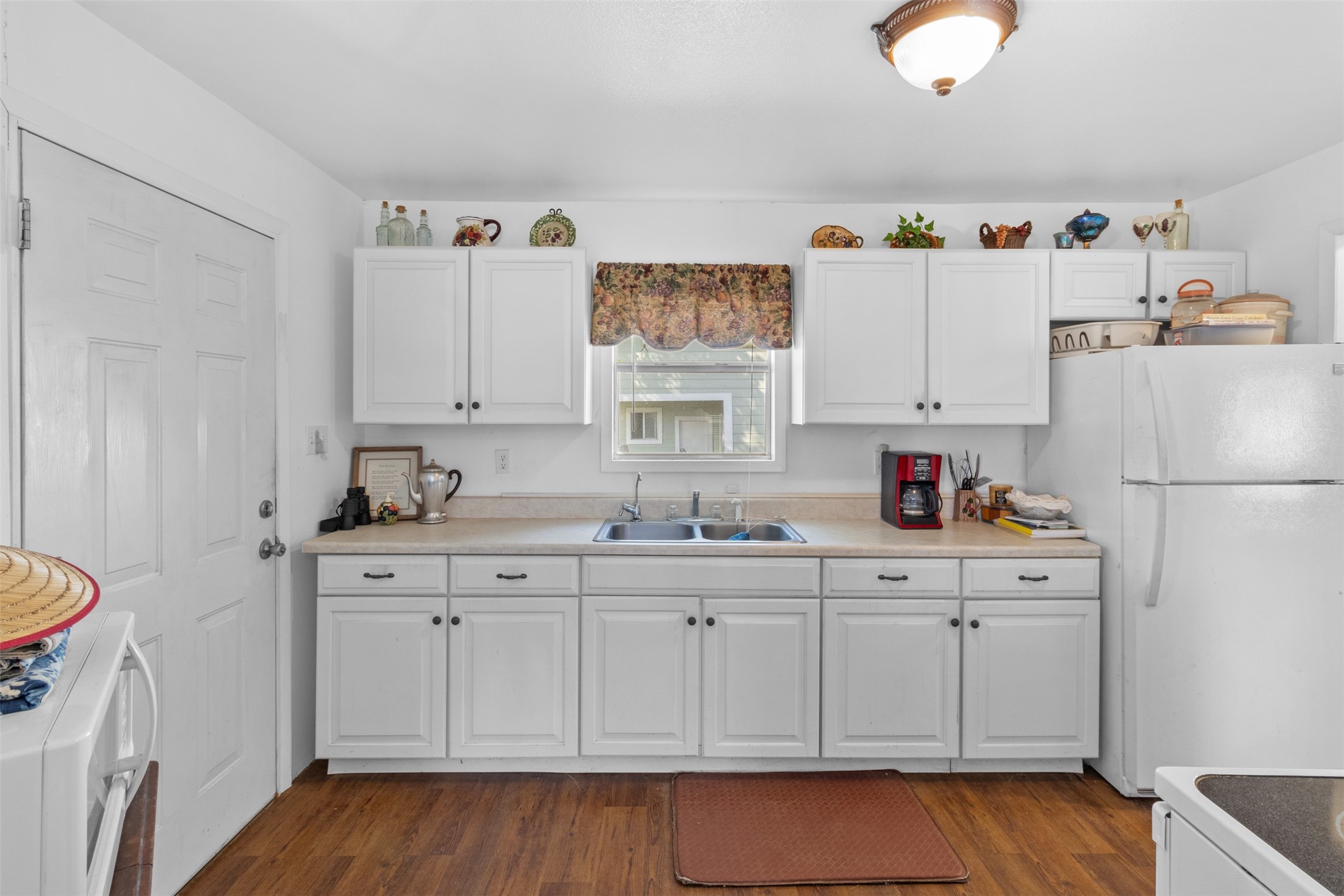 1619 Highway 237 Carmine, TX 78932 - Photo 18 of 26 a kitchen with white cabinets and sink