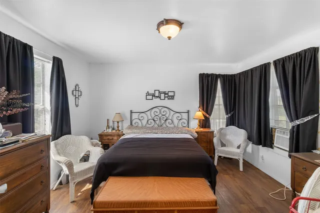 a bedroom with a bed and chair