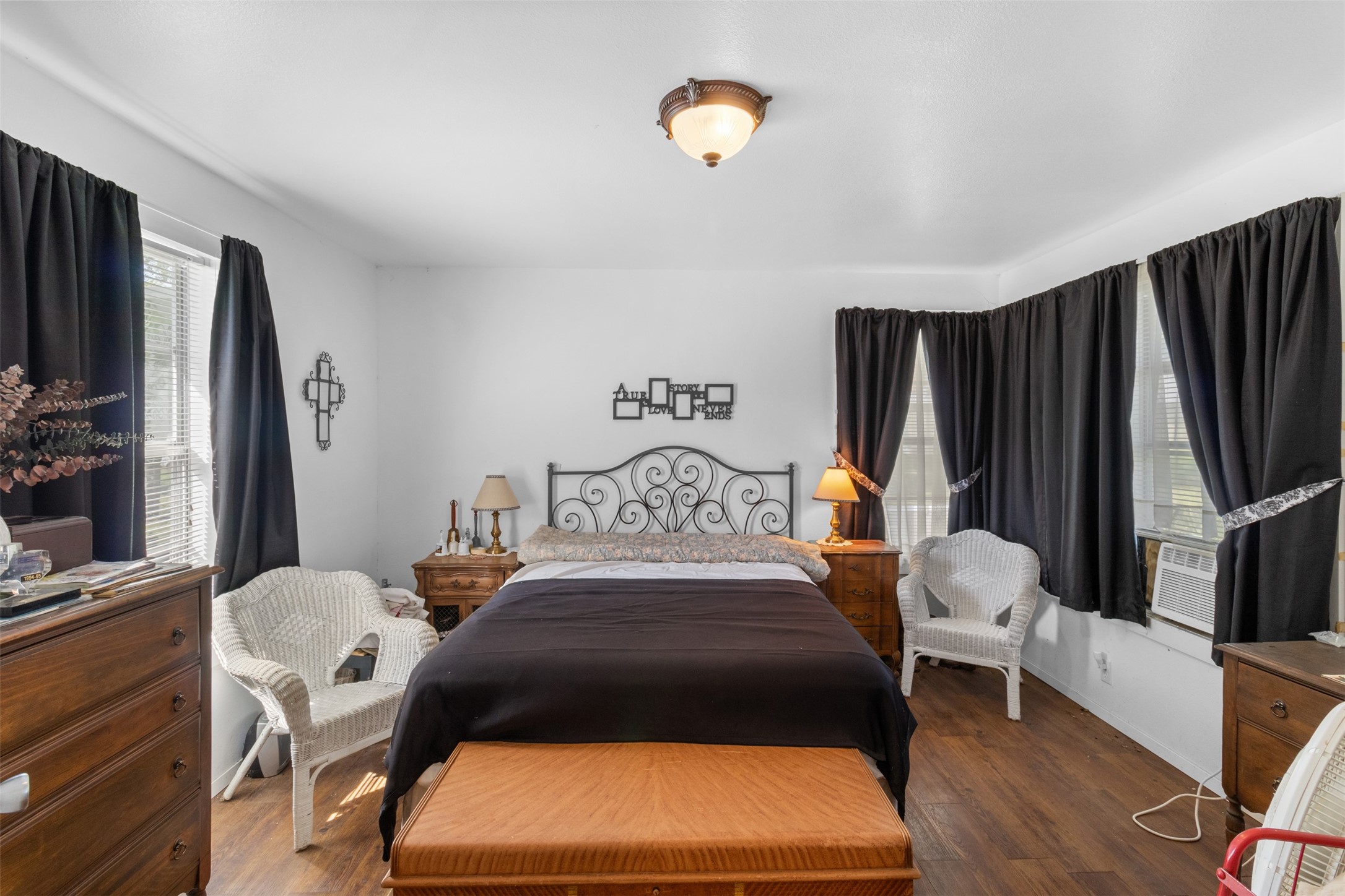 1619 Highway 237 Carmine, TX 78932 - Photo 20 of 26 a bedroom with a bed and a flat tv screen on the dresser