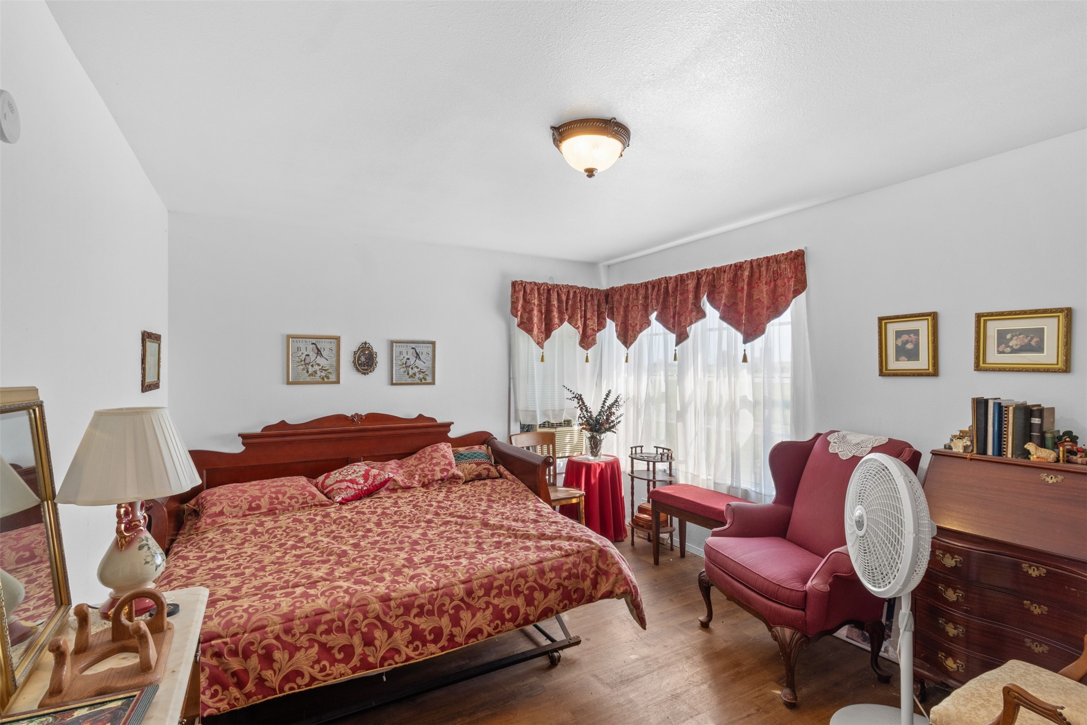 1619 Highway 237 Carmine, TX 78932 - Photo 21 of 26 a bedroom with a bed and chair