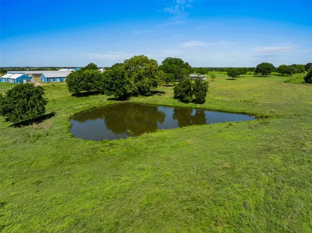 a aerial view of a house with a yard