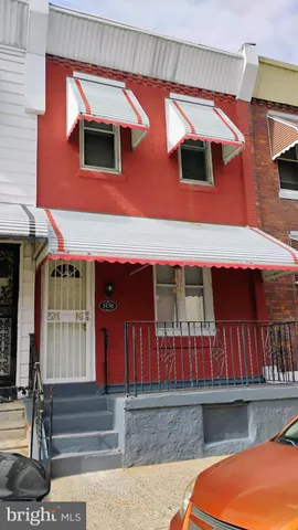 a front view of a house with large windows