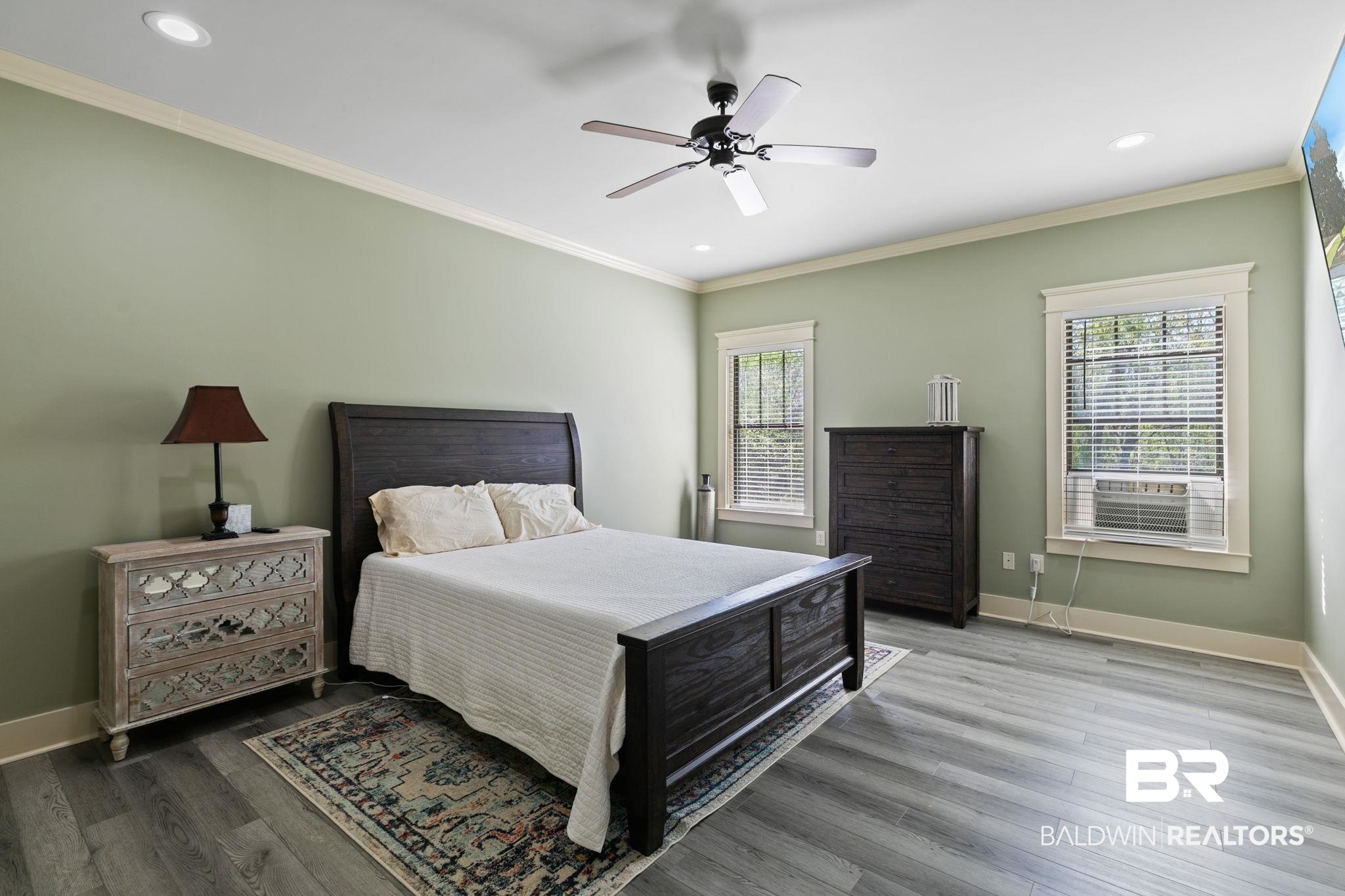 9584 Sanibel Loop Daphne, AL 36526 - Photo 20 of 48 Bedroom with wood finished floors, crown molding, ceiling fan, and recessed lighting