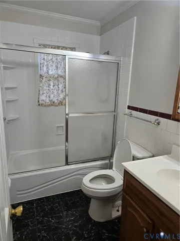 a bathroom with a toilet a sink and shower