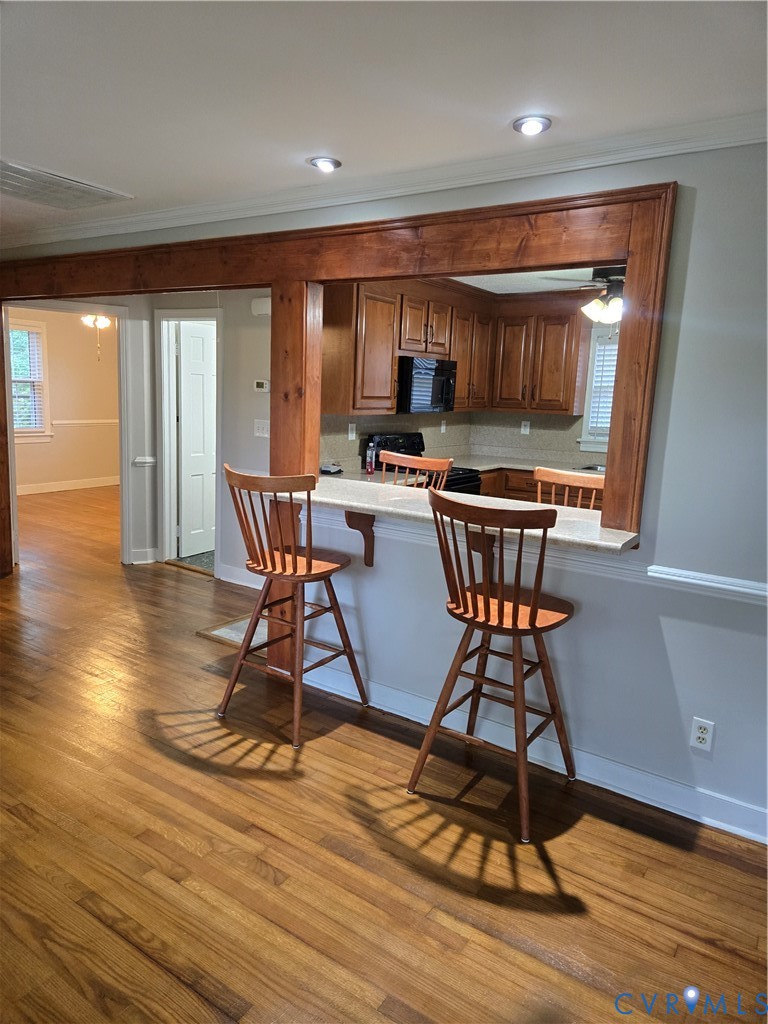 2707 Academy Road Powhatan, VA 23139 - Photo 4 of 27 a view of a dining room with furniture window and wooden floor