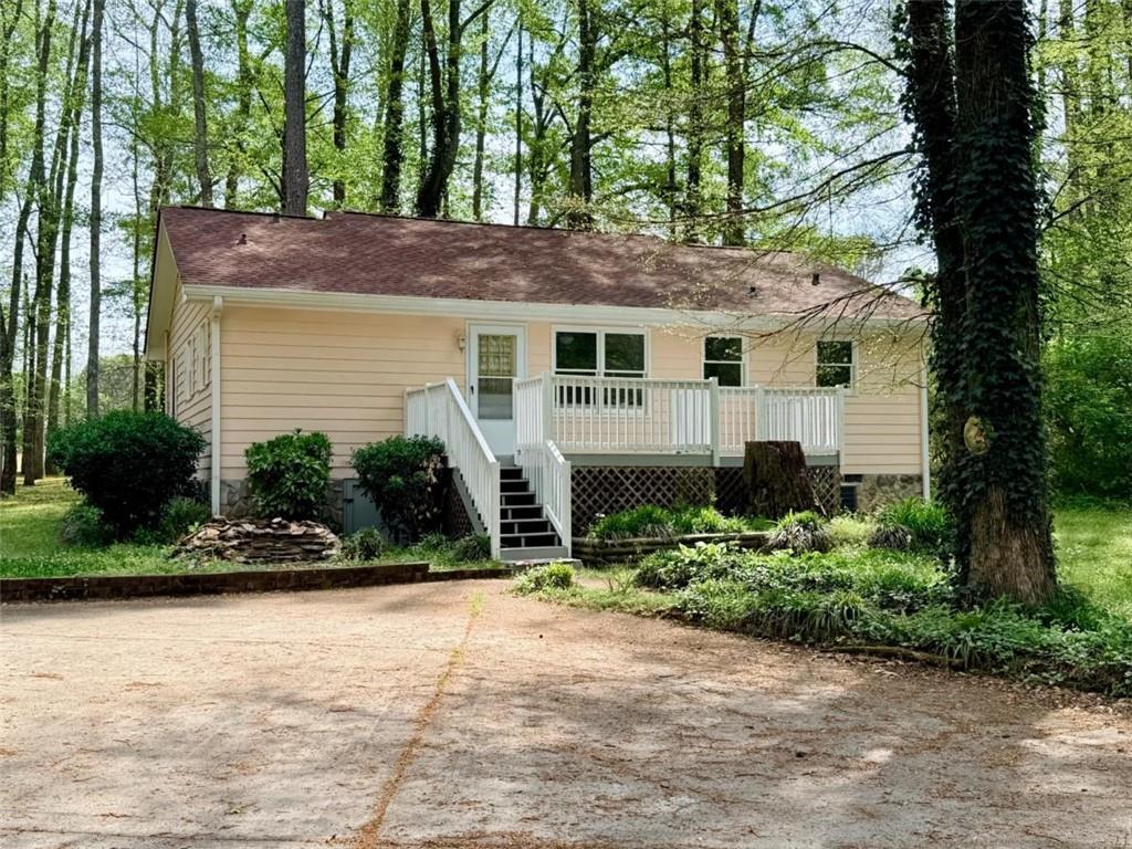 1129 Cave Springs Road Douglasville, GA 30134 - Photo 2 of 21 a view of a house with a yard