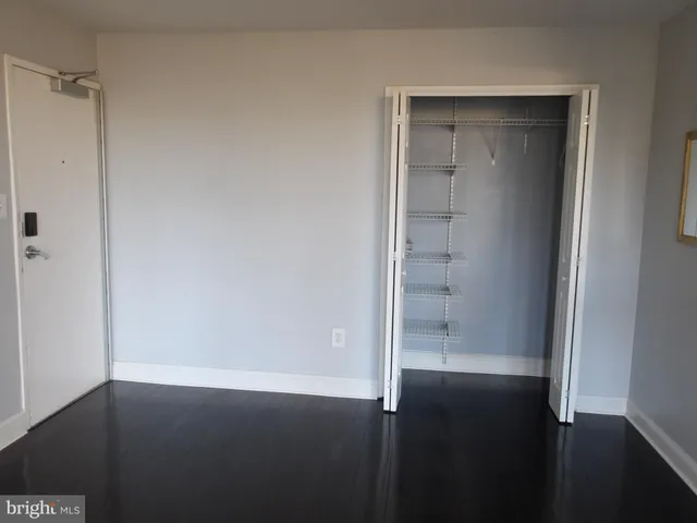 a kitchen with granite countertop a refrigerator stove and microwave