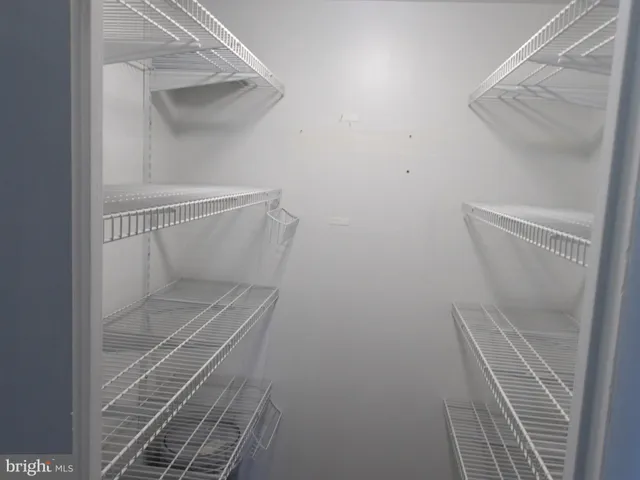 a bathroom with a granite countertop toilet and a shower