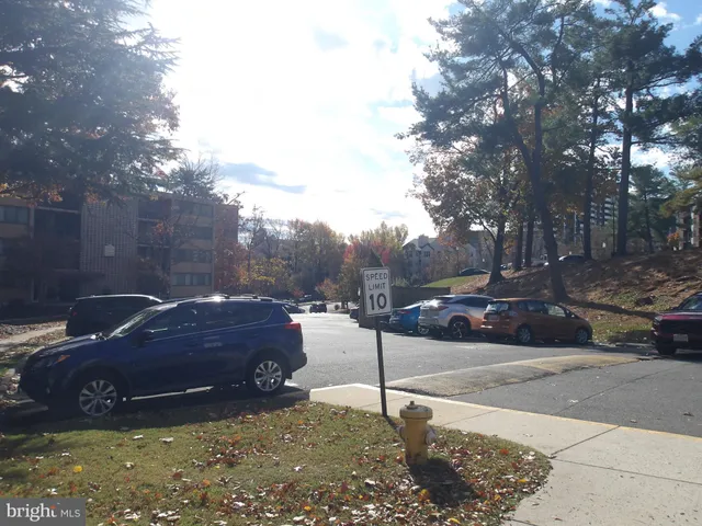 a view of street with parked cars