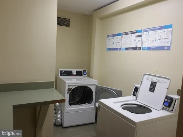 a view of a kitchen with wooden floor and a kitchen