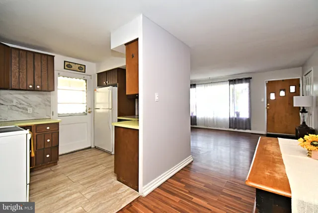 a view of a kitchen cabinets and wooden floor
