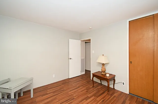 a bedroom with a bed and a table in it