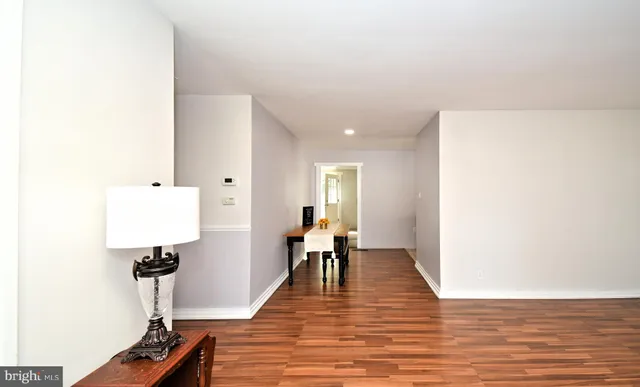 a view of dining room with furniture and wooden floor