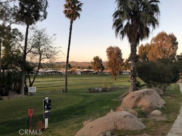a view of swimming pool with a yard