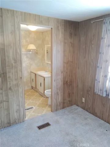 a view of a bathroom with a glass door and shower