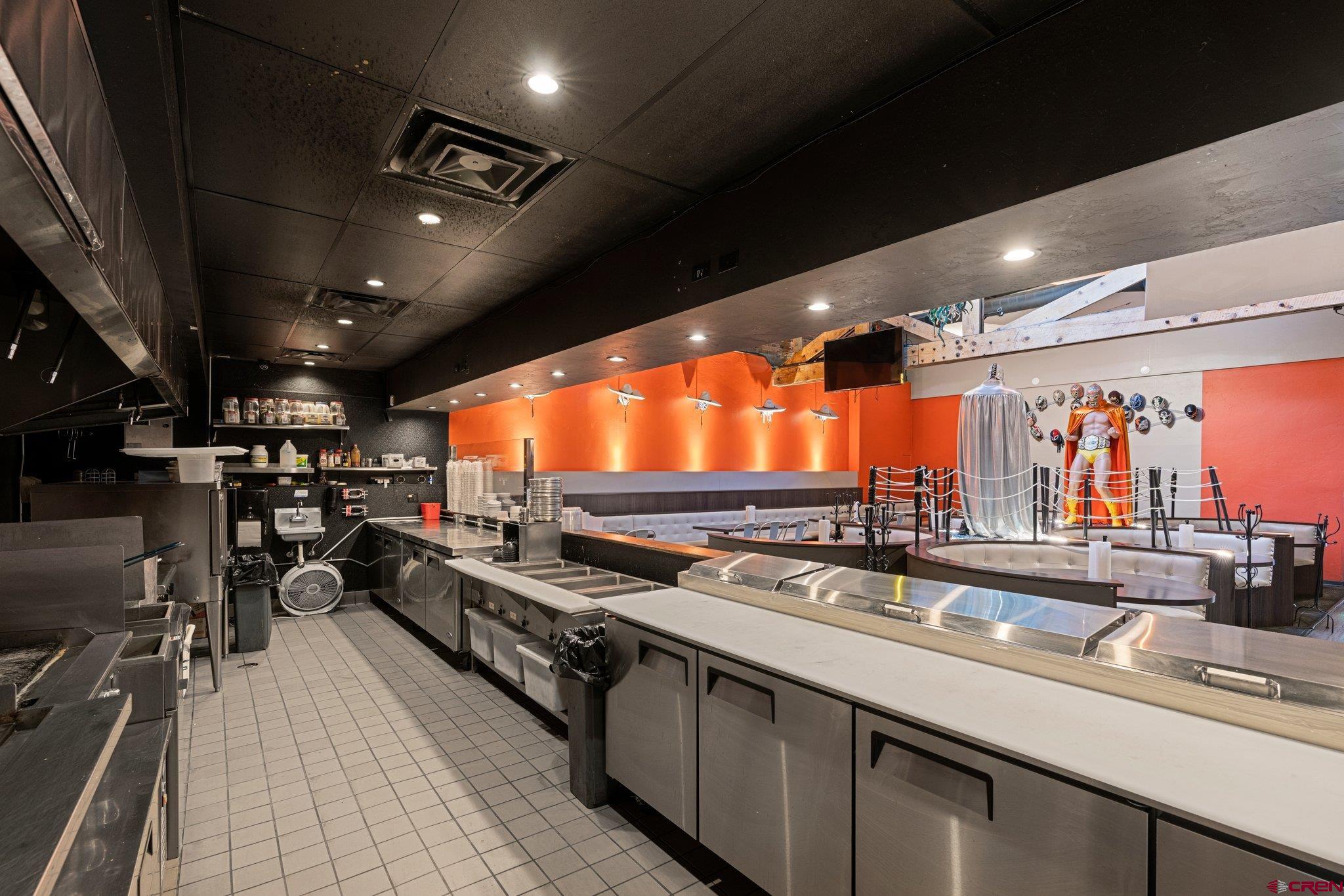 1150 Main Avenue Durango, CO 81301 - Photo 14 of 35 a kitchen with lots of counter top space and a wooden floor