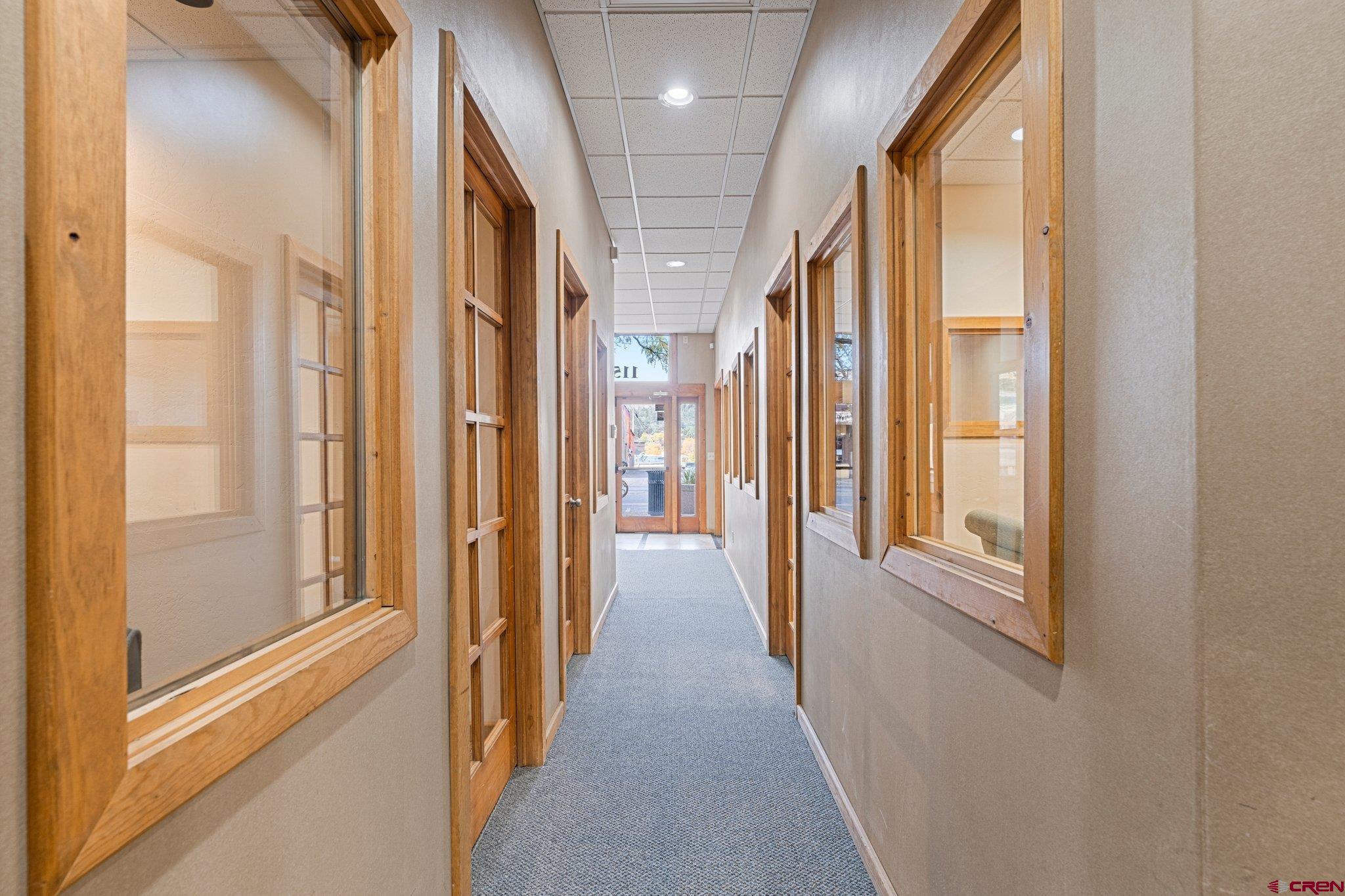 1150 Main Avenue Durango, CO 81301 - Photo 24 of 35 a view of a hallway with wooden floor and staircase