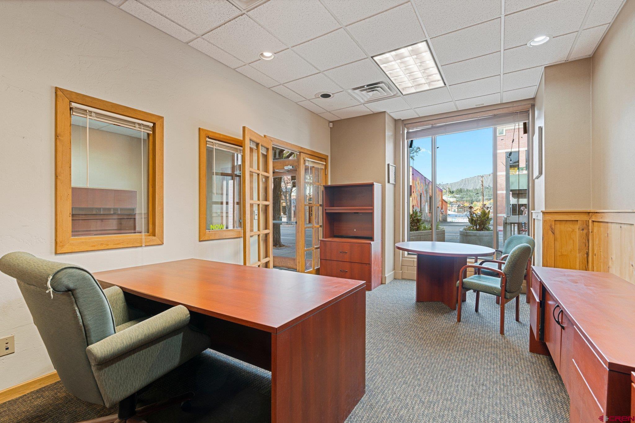 1150 Main Avenue Durango, CO 81301 - Photo 25 of 35 a open kitchen with stainless steel appliances granite countertop a dining table and chairs
