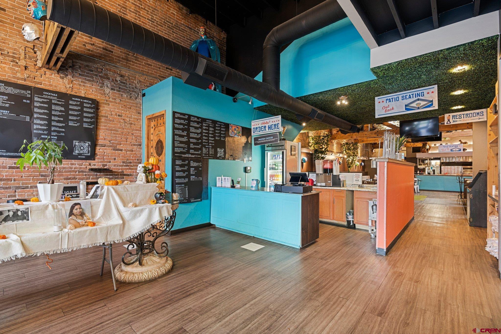 1150 Main Avenue Durango, CO 81301 - Photo 6 of 35 a view of a kitchen with furniture and wooden floor