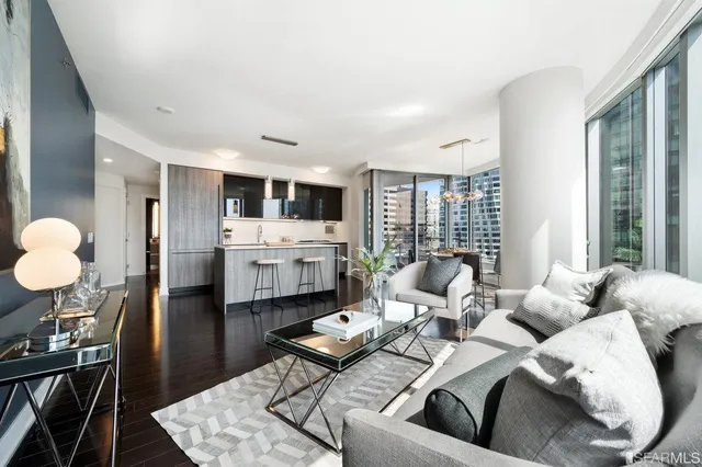 a living room with furniture and a table
