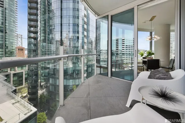 a bedroom with a bed and large window