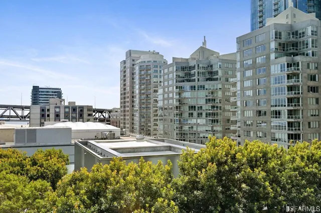 a kitchen with a refrigerator and cabinets