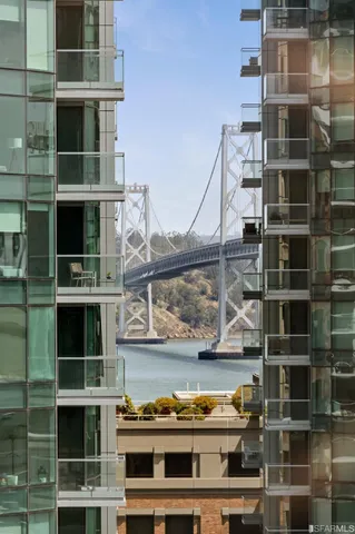 a bedroom with bed couch and potted plant