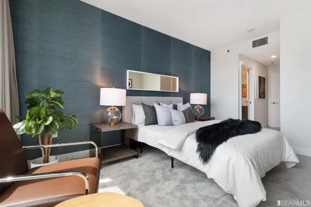 a bathroom with a sink shower and a mirror