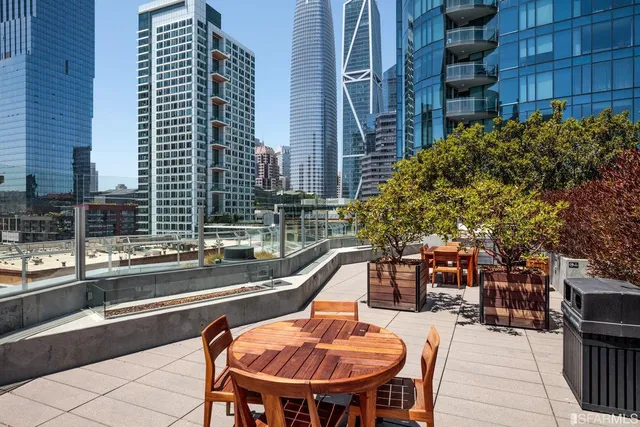 a outdoor space with a table and chairs