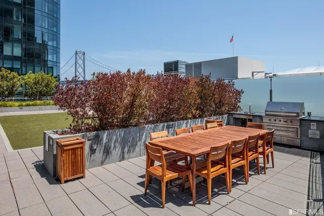 a view of balcony with two chairs and potted plants