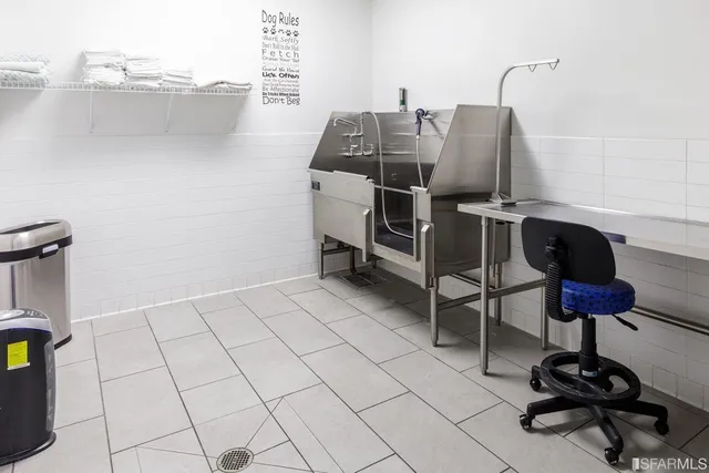 a view of water heater room with wooden floor