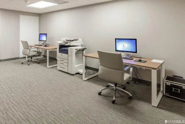 a view of a building with sitting area