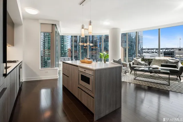 a view of living room with furniture and floor to ceiling window