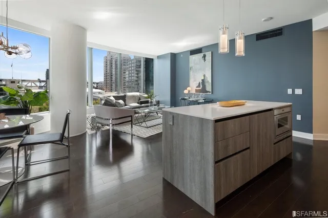 a view of a livingroom with furniture window and wooden floor