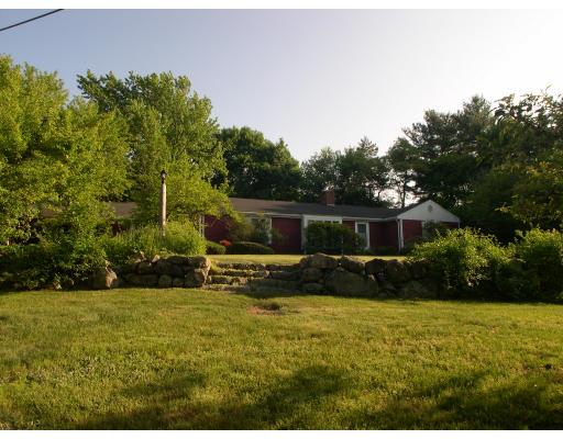42 Longmeadow Road Weston, MA 02493 - Photo 2 of 7 a view of a backyard with plants potted plants and large tree