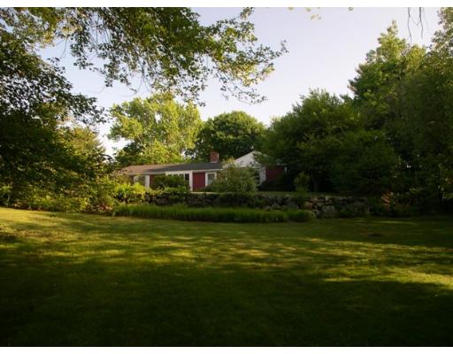 42 Longmeadow Road Weston, MA 02493 - Photo 7 of 7 a front view of a house with a garden