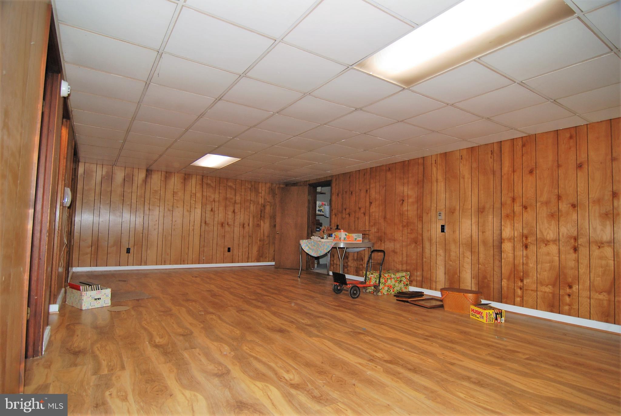 6712 South Clifton Road Frederick, MD 21703 - Photo 13 of 28 a view of a livingroom with furniture and wooden floor