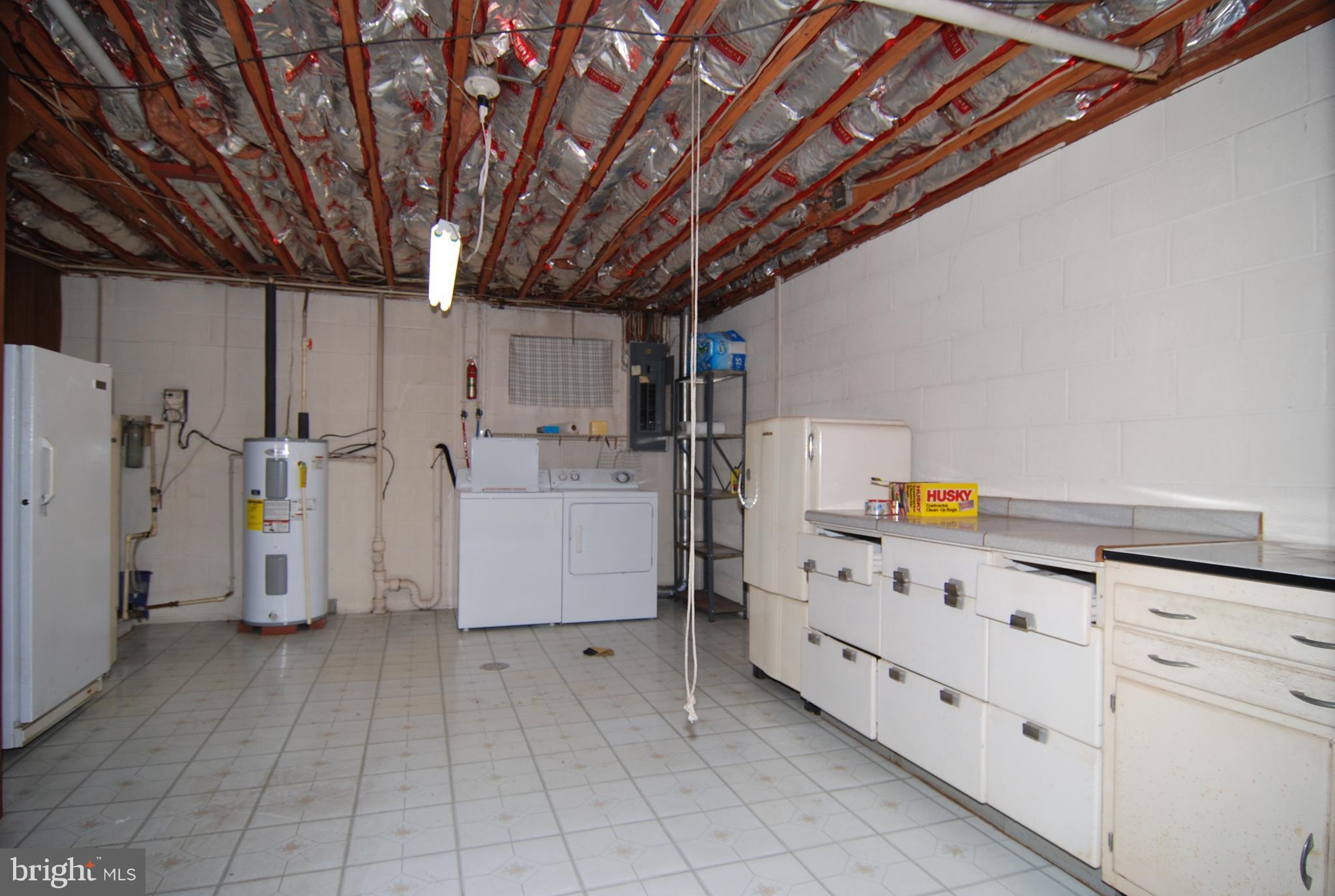 6712 South Clifton Road Frederick, MD 21703 - Photo 22 of 28 a utility room with cabinets