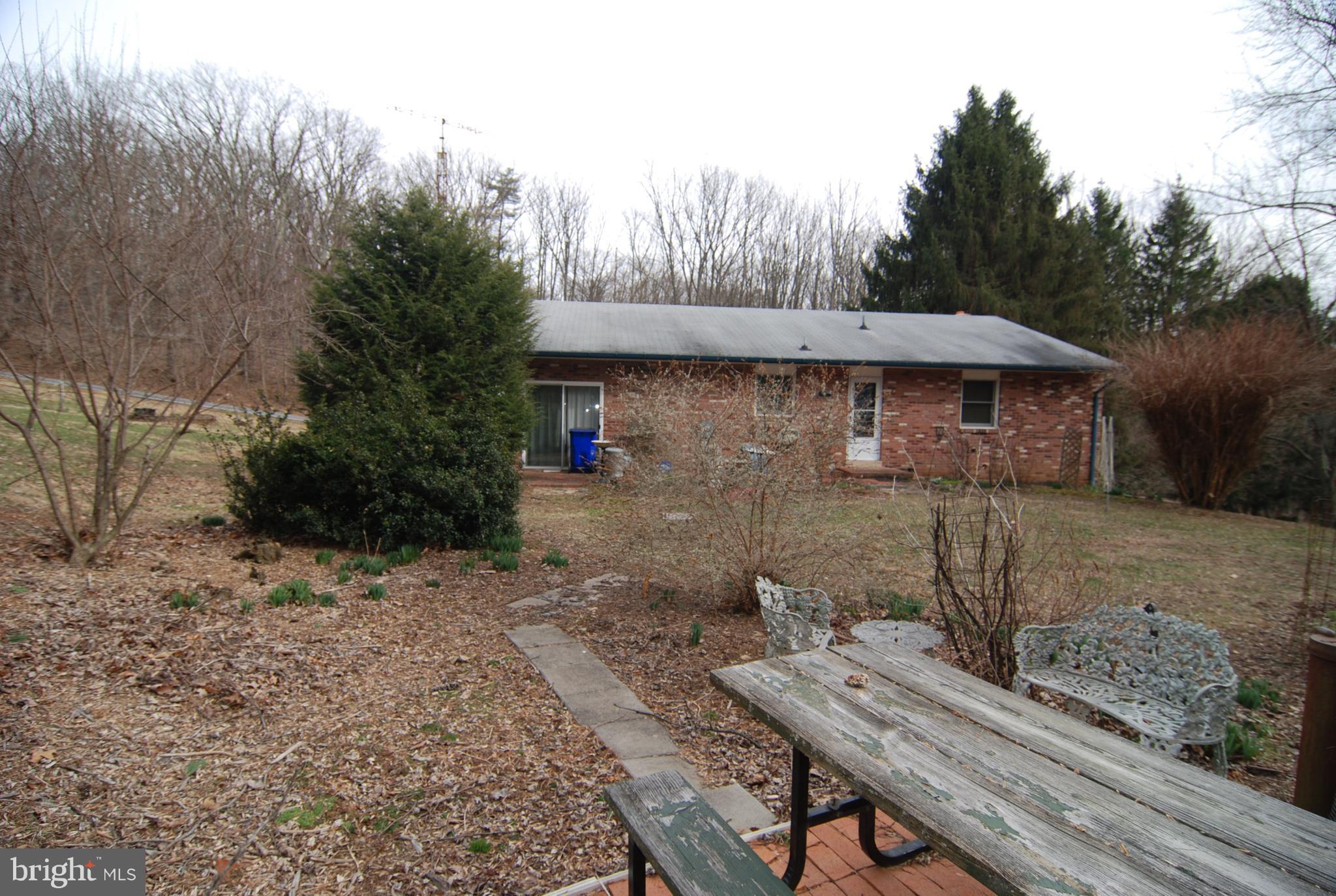 6712 South Clifton Road Frederick, MD 21703 - Photo 27 of 28 a view of a house with backyard and sitting area