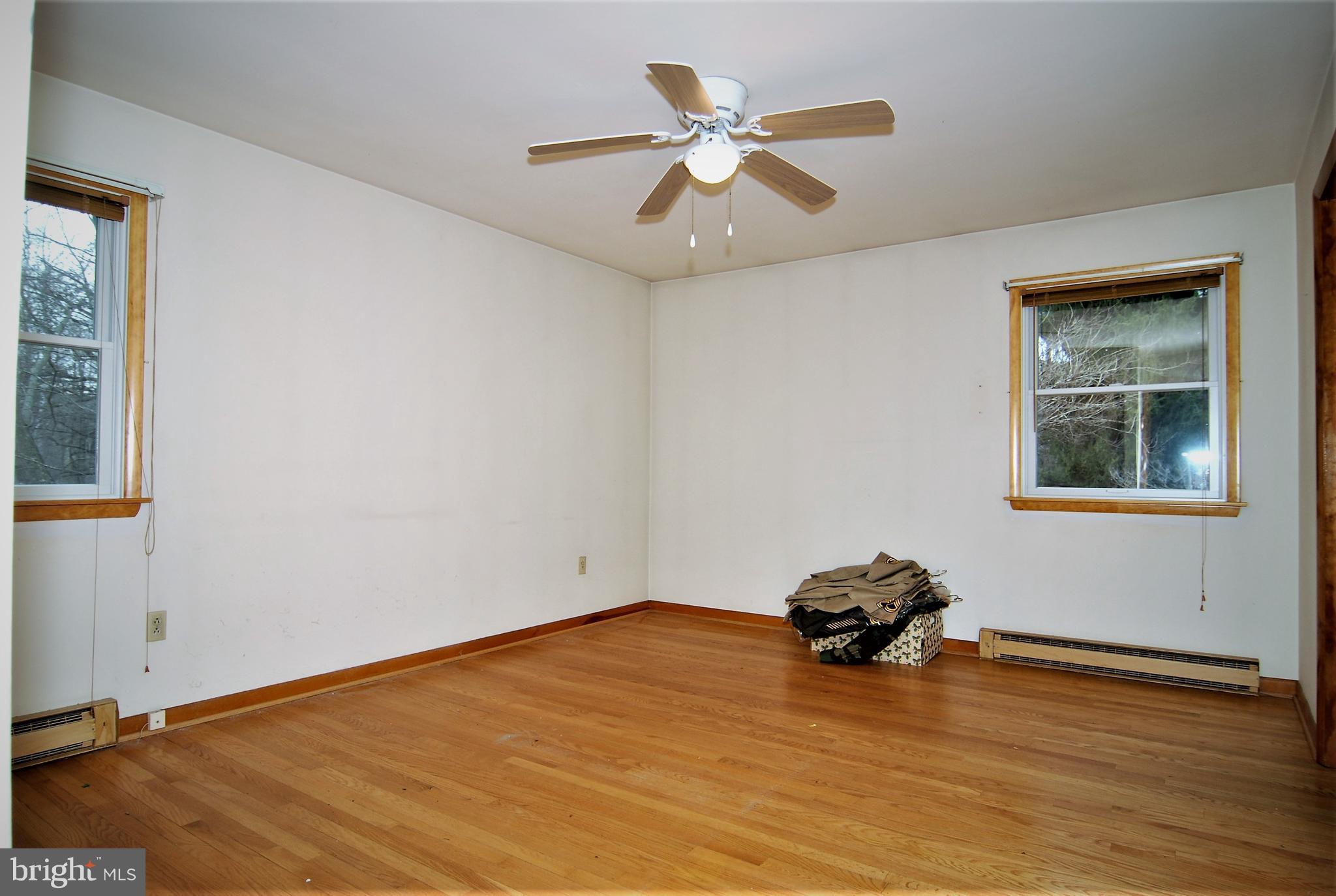 6712 South Clifton Road Frederick, MD 21703 - Photo 6 of 28 a view of empty room with wooden floor