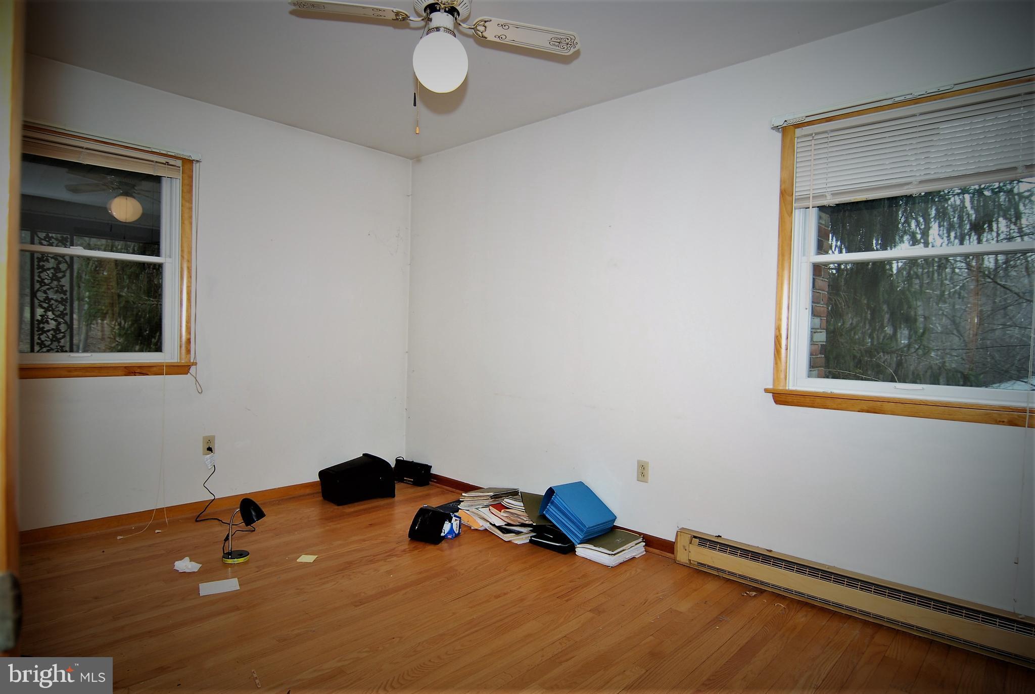 6712 South Clifton Road Frederick, MD 21703 - Photo 10 of 28 a room with a wooden floor and a window