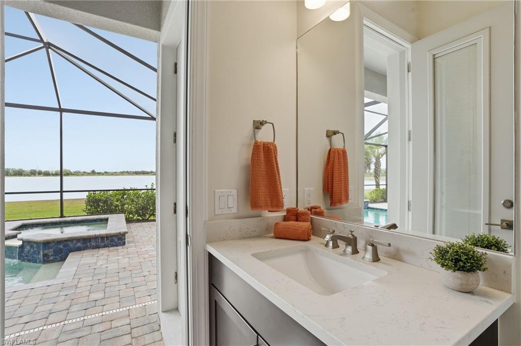 19696 Aqua View Lane Fort Myers, FL 33913 - Photo 36 of 50 a bathroom with a double vanity sink and a mirror