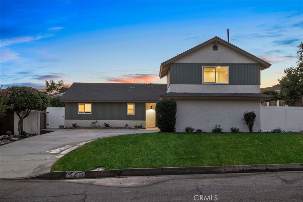 6210 Halsted Avenue Rancho Cucamonga, CA 91737 - Photo 1 of 21 a front view of a house with a yard and garage