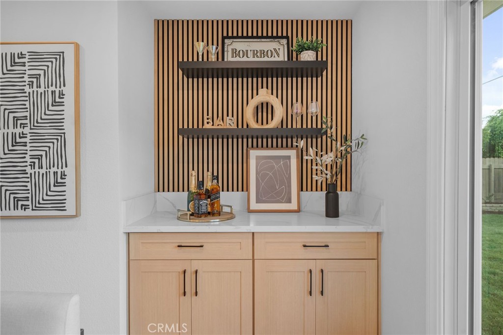 6210 Halsted Avenue Rancho Cucamonga, CA 91737 - Photo 7 of 21 a kitchen with a sink and a mirror
