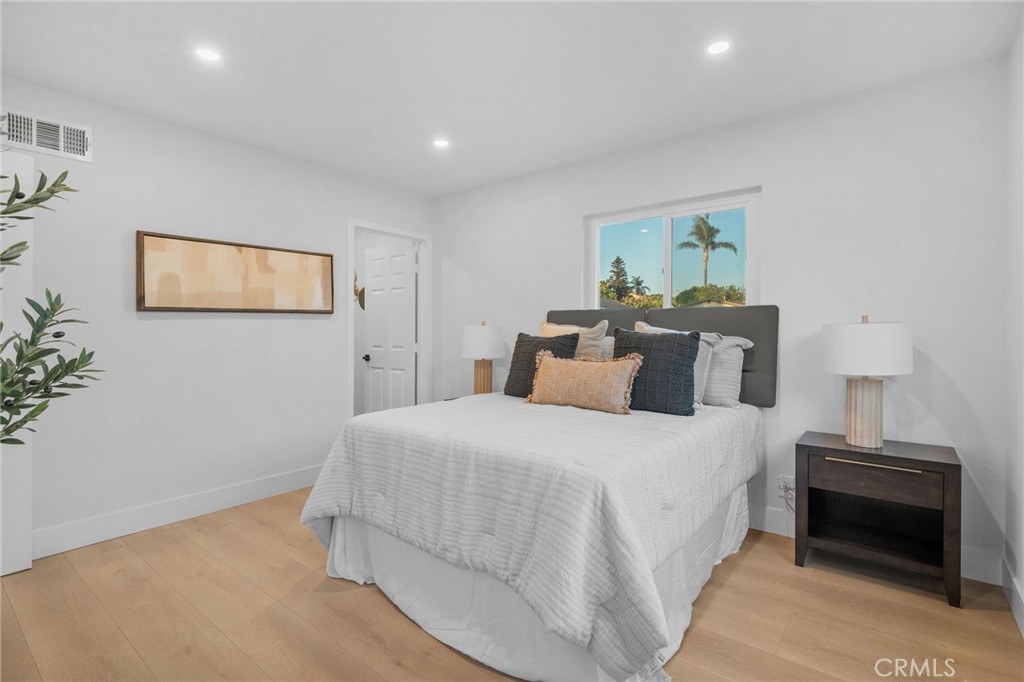 6210 Halsted Avenue Rancho Cucamonga, CA 91737 - Photo 10 of 21 a bedroom with a bed and a painting on the wall