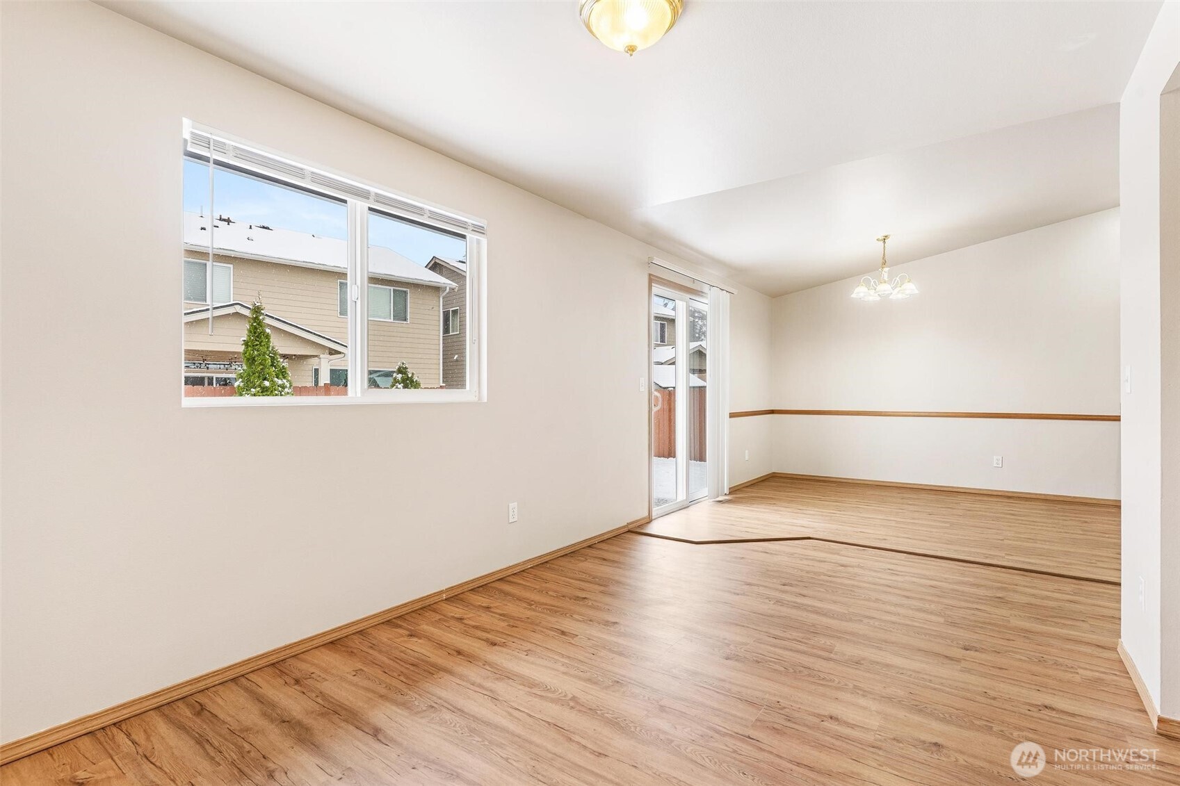 924 Merea Lane Sultan, WA 98294 - Photo 13 of 30 a view of an empty room with wooden floor and a window